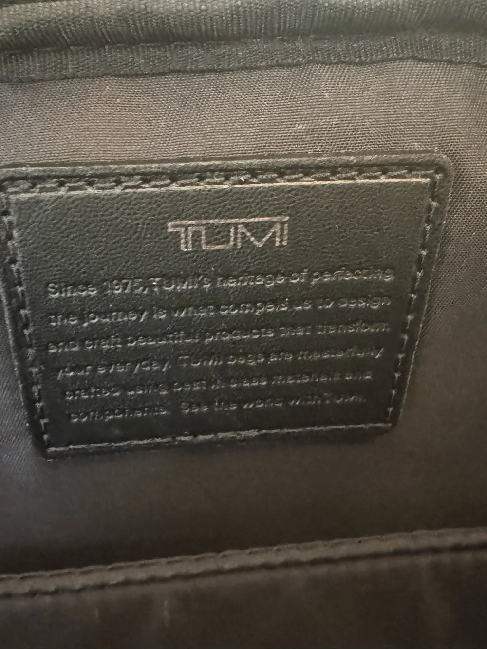 Tumi Gray Parrish Backpack with Black Trim and Tan Leather Tag